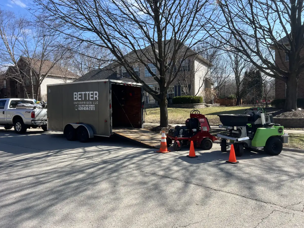 Better Turf and Snow branded equipment trailer loaded with commercial lawn care equipment in Aurora, IL