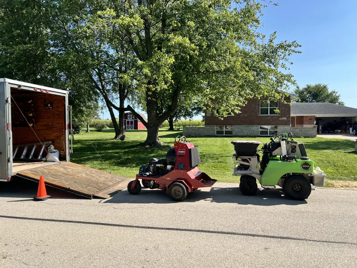 Better Turf and Snow crew unloading equipment from trailer at a residential property in the Fox Valley, IL