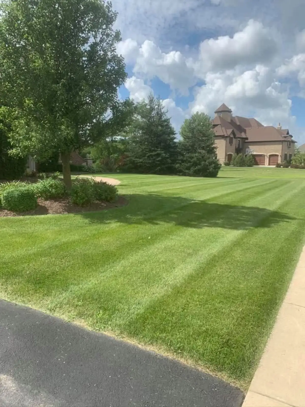 Precision mowing stripes on a large Yorkville, IL estate lawn