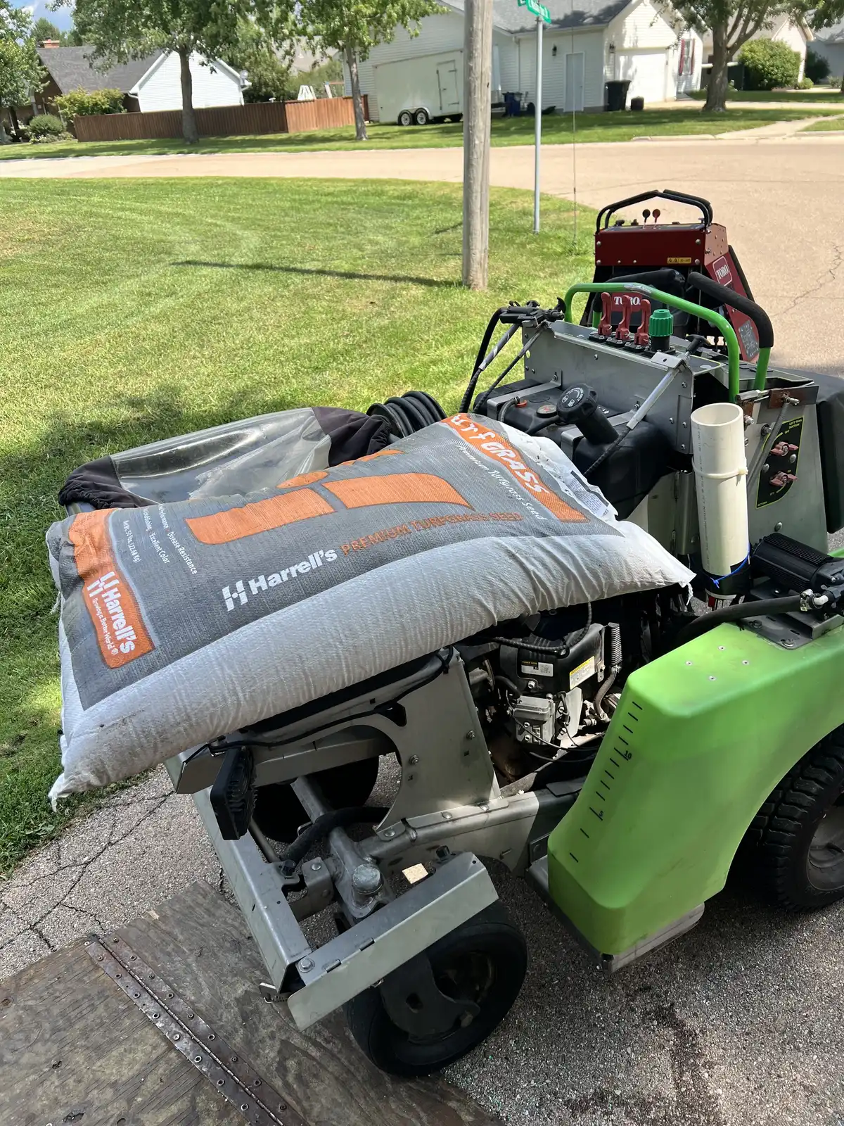 Professional lawn striping pattern on a residential property in Aurora, IL showing thick healthy turf